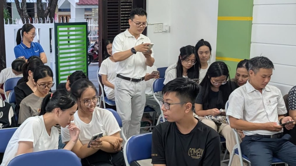 Attendees seated and engaging with the session